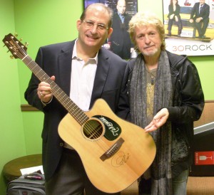 Scott Bluebond (L) and Jon Anderson pose with the signed guitar in the green room of The 10! Show.