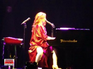 Aging with grace, Tori Amos hides behind a bazillion megawatt floor spotlight. Good luck seeing her face at all… Photo by Amanda Collins